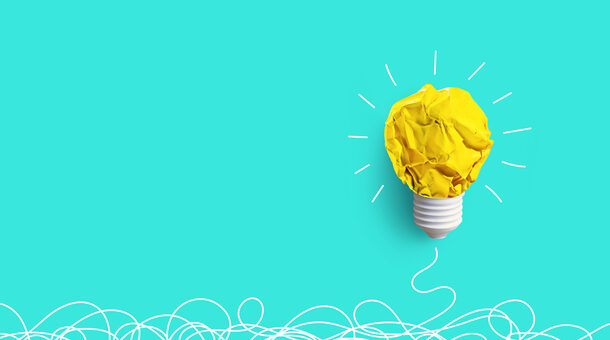 Creativity inspiration,ideas concepts with lightbulb from paper crumpled ball